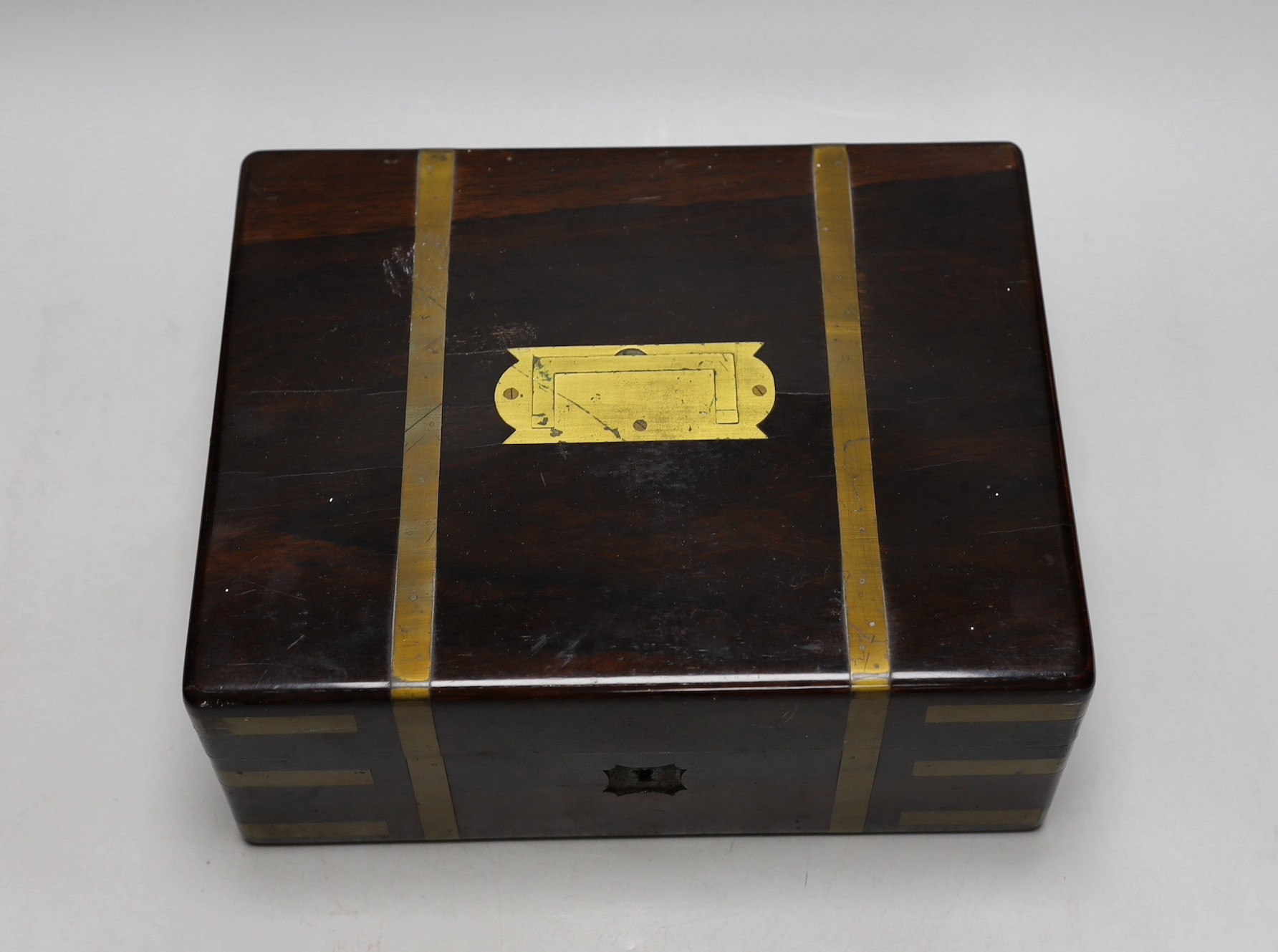 A Victorian rosewood brass bound toilet box, with contents, 21cms deep x 27cms wide